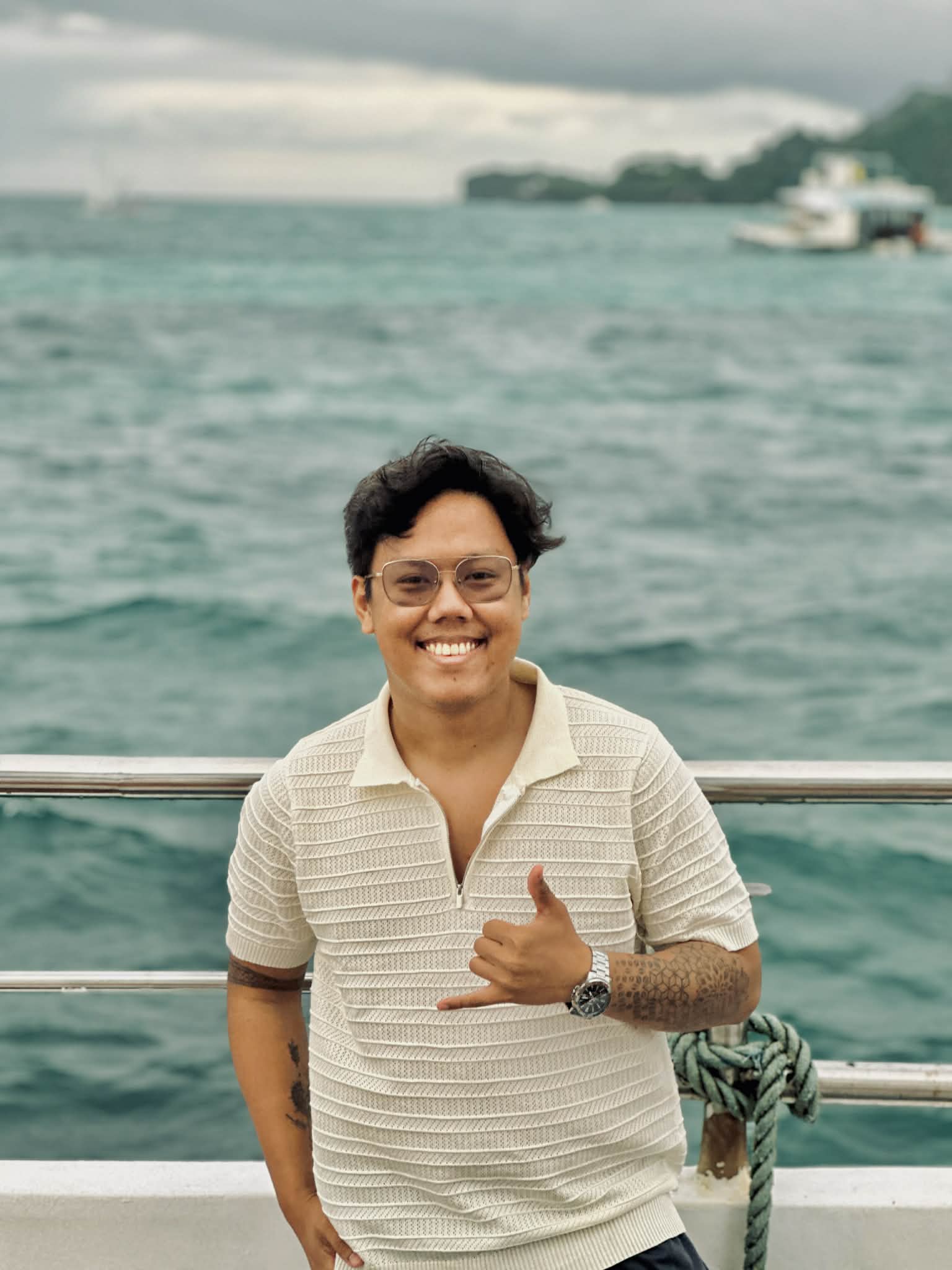 Josh Dev PH smiling by the sea